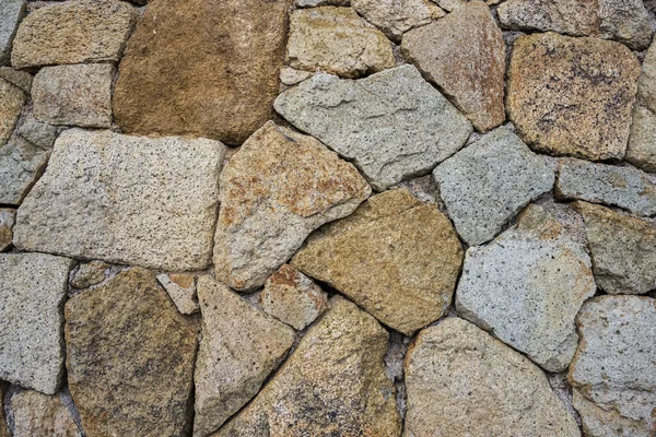 背景や質感としての天然石壁の断片 — ストック写真