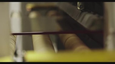 The glass goes into the machine on rollers and goes through the tempering process