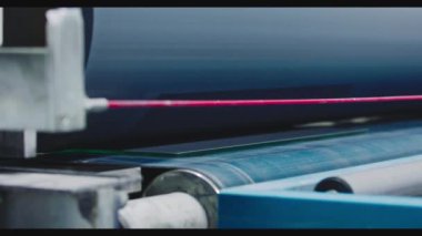 The glass goes into the machine on rollers and goes through the tempering process