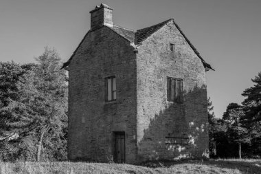 Old stone building standing on a hill 