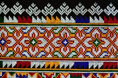 El işlemesi Yao Mien renkli desenli nakış, geleneksel kabile tekstili, karmaşık dikiş, arka plan, tasarım ve kültürel sanat projeleri için mükemmel..