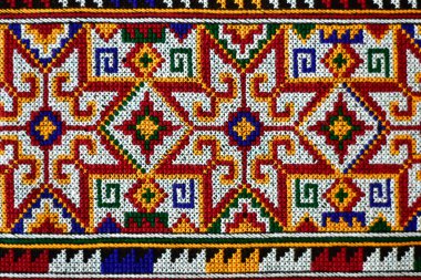 El işlemesi Yao Mien renkli desenli nakış, geleneksel kabile tekstili, karmaşık dikiş, arka plan, tasarım ve kültürel sanat projeleri için mükemmel..
