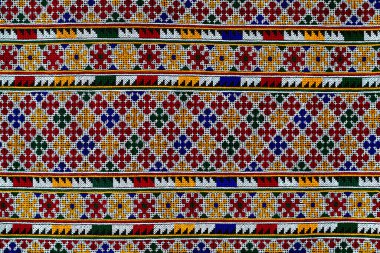 El işlemesi Yao Mien renkli desenli nakış, geleneksel kabile tekstili, karmaşık dikiş, arka plan, tasarım ve kültürel sanat projeleri için mükemmel..