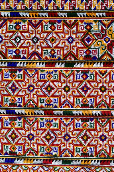 El işlemesi Yao Mien renkli desenli nakış, geleneksel kabile tekstili, karmaşık dikiş, arka plan, tasarım ve kültürel sanat projeleri için mükemmel..