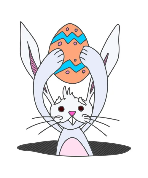 ウサギはぬり絵の卵を持ったままミンクから這い出した ストック画像 — ストック写真