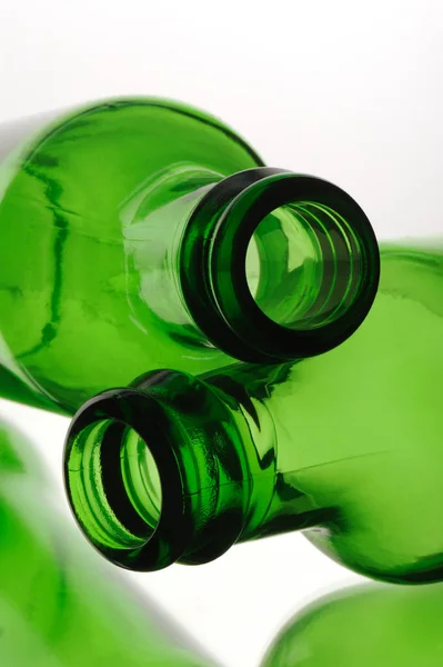 bottle of green beer and wine on white background
