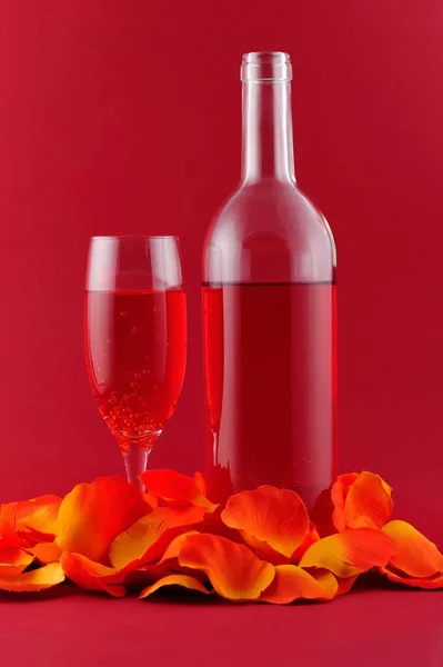 Pink Liquor Bottle Glass Custom Made Orange Rose Petals Front — Stock Photo, Image