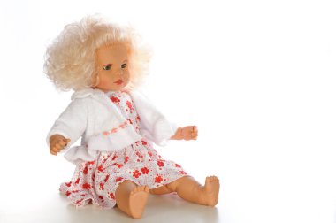 A doll in a white dress with red polka dots. on a white background clipart