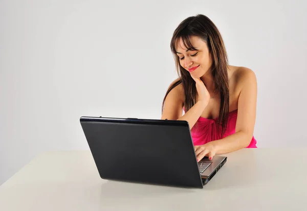 stock image young beautiful woman with a laptop on a white background