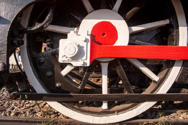 stock image old steam locomotive with a red and white