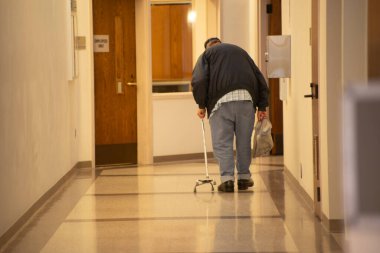 Johnson City, Tennessee, United States    2024-02-13       Downtown: Memorial Park: Johnson City Community Center. Man in hall.