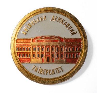 The object on white is a 1970s Soviet metal badge Kyiv State University. TEXT TRANSLATION: Kyiv State University
