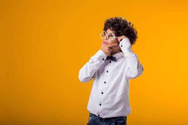 Thoughtful child boy has idea.Education and curiosity concept