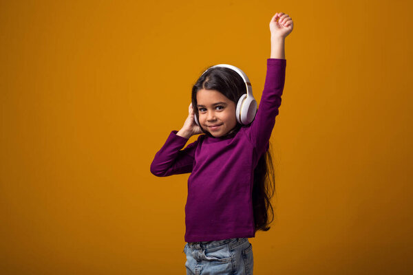 Portrait Smiling Kid Girl Wearing Pink Dress Enjoying Music Headphones Stock Picture