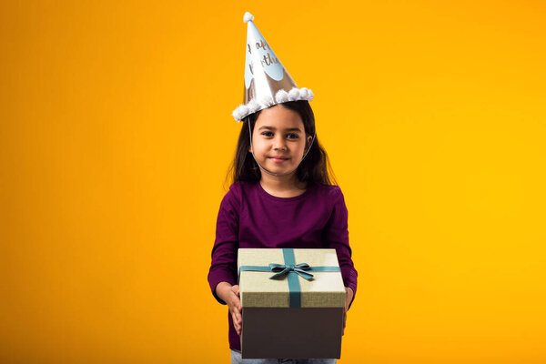 Portrait Smiling Kid Girl Holding Giftbox Yellow Background Birthday Celebration Stock Image
