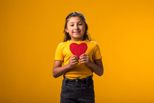 Portrait Child Girl Holding Paper Heartover Yellow Background Love Care Royalty Free Stock Images