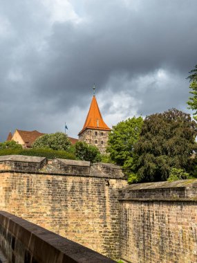 City gate tower Tiergartnertor in Nuremberg. Medieval architecture in Germany at cloudy summer day clipart