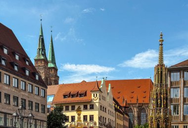 Schoner Brunnen ancient fountain and Frauenkirche Church at Hauptmarkt main square in Nuremberg old town. Nuremberg is the second largest city of Bavaria state in Germany. clipart