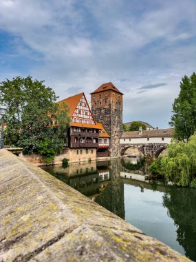 General view of the Maxbrucke (Max bridge) on the Pegnitz river in old town of Nuremberg. Travel in Bavaria clipart