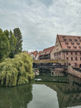 General view of the Maxbrucke (Max bridge) on the Pegnitz river in old town of Nuremberg. Travel in Bavaria clipart