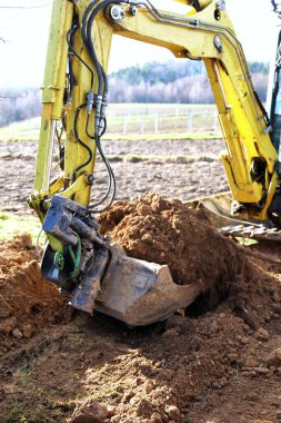 Earthmoving using a small crawler excavator