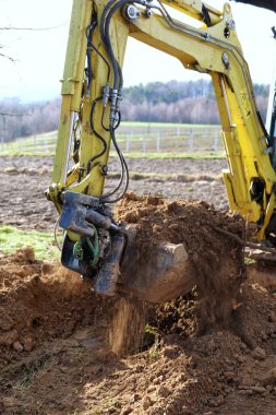 Earthmoving using a small crawler excavator