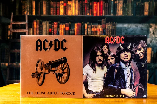 stock image Chambersburg Pennsylvania USA 6-06-2023 old AC/DC vinyl records on table with retro looking library background