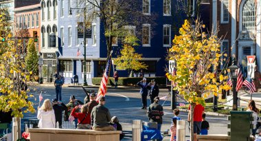 Chambersburg Pennsylvania USA 11-11-2024 veterans honoring color guard marching into town square on veterans day clipart