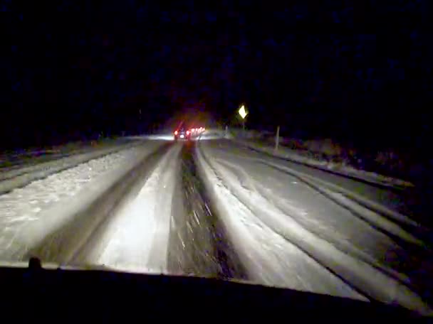 Car Drives Slowly Night Slippery Snowy Road Usa — Wideo stockowe