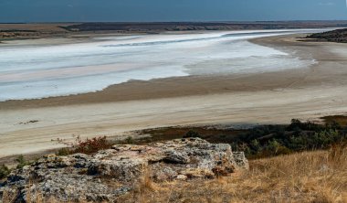 Natural landscape of the south of Ukraine, View of the drying Kuyalnitsky estuary with rose water, in which Artemia salina and Dunaliella algae live