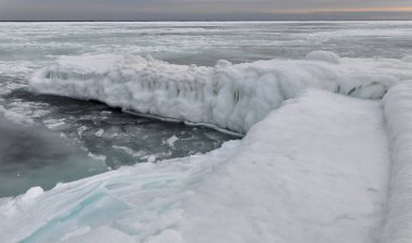 Coastal cliffs and coastal protection structures frozen with ice in the cold winter of 2010, the Black Sea