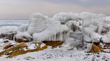 Coastal cliffs and coastal protection structures frozen with ice in the cold winter of 2010, the Black Sea