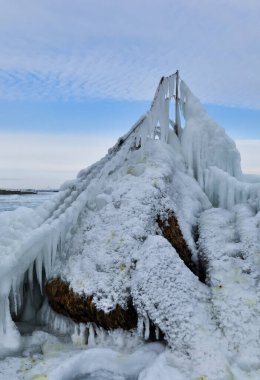 Coastal cliffs and coastal protection structures frozen with ice in the cold winter of 2010, the Black Sea