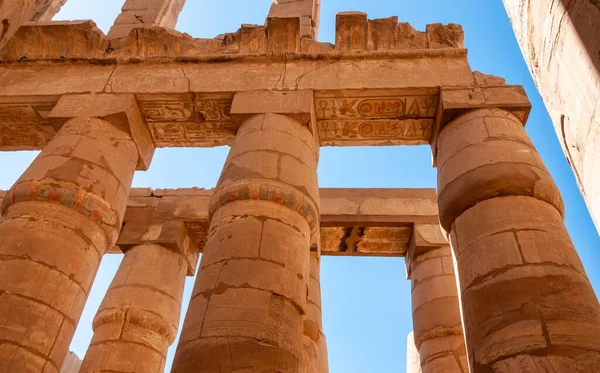 stock image EGYPT,  LUXOR - MARCH 01, 2019: ancient temple columns with hieroglyphs, drawings and inscriptions at Karnak in Luxor, Egypt