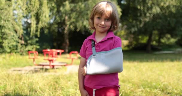 Small Handsome Boy Broken Arm Wrapped Bandage Injured Child Playground — Stock Video