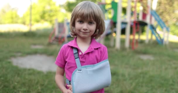 Small Handsome Boy Broken Arm Wrapped Bandage Injured Child Playground — Stock Video