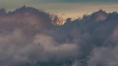 Winter mountains hidden in fast motion clouds at cold sunrise in frozen nature Time lapse. Outdoor adventure Background video