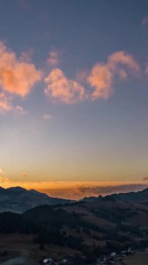 Aerial view of Evening sky after sunset in countryside nature landscape, Vertical video background. Hyper Time lapse, Ideal for social media stories 