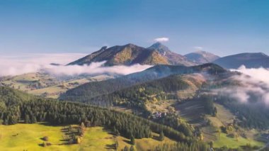 Aerial view Hyperlapse of alpine countryside nature with mist clouds motion fast in sunny autumn mountains. Time lapse, Hyper lapse, Beautiful natural background scenery. 