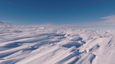 Dolly shot over frozen snowy structure in sunny winter mountains pattern texture background. Panorama of beautiful frost nature 