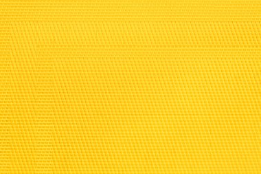 Sarı kumaş dokusu, yakın çekim. Çuval bezi arka planı.