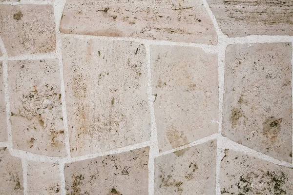 石畳の道はベージュのタイルで舗装されています 石の質感 グランジの背景 — ストック写真