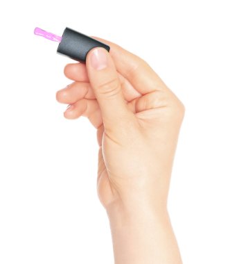 Woman hand holds cosmetic nail polish brush, isolated on a transparent background, cosmetic concept
