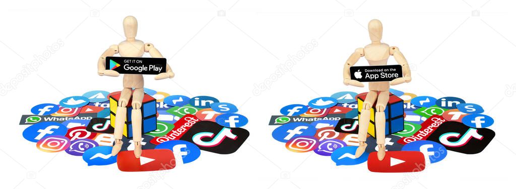 Set of Wooden manikin, which holding paper Black Buttons of Get in on Google Play and Download on the App Store, with social media apps icons, isolated on a transparent background
