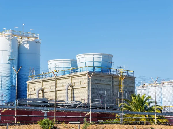 Modern chemical plant for petrochemical products in Spain. Industrial building. Production structures. Ecology, environmental pollution by processed products.