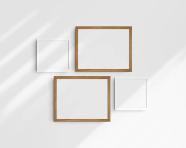 Galeri duvarı modelleme seti, 4 kiraz ağacı ve beyaz çerçeve. Temiz, modern ve minimalist çerçeve modeli. İki yatay çerçeve ve iki kare çerçeve, 14x11 (14: 11), 8x8 (1: 1) inç, gölgeli beyaz bir duvar üzerinde.