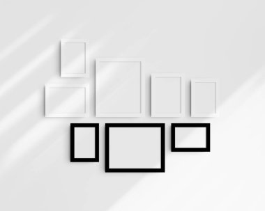 Galeri duvarı modelleme seti, 8 tane siyah beyaz çerçeve. Temiz, modern ve minimalist çerçeve modeli. Beş dikey çerçeve ve üç yatay çerçeve, 4x6 (2: 3), 6x4 (3: 2), 5x7 (5: 7), 7x5 (7: 5), 8x10 (4: 5), 10x8 (5: 4) inç, gölgeli beyaz bir duvar üzerinde.