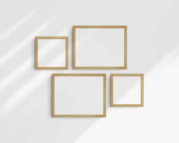 画廊壁面造型 4个橡木木架 简约的框架模型 两个水平框架和两个正方形框架 14X11 8X8 在有阴影的白墙上 — 图库照片