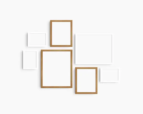 Gallery wall mockup set, 7 white and cherry wood frames. Clean, modern, and minimalist frame mockup. Three horizontal frames, and four vertical frames, 5x7 (5:7), 7x5 (7:5), 8x10 (4:5), 12x15 (4:5), 15x12 (5:4) inches, on a white wall.