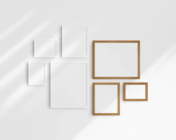 Gallery wall mockup set, 7 white and cherry wood frames. Clean, modern, and minimalist frame mockup. Three horizontal frames, and four vertical frames, 5x7 (5:7), 7x5 (7:5), 8x10 (4:5), 12x15 (4:5), 15x12 (5:4) inches, on a white wall with shadows.